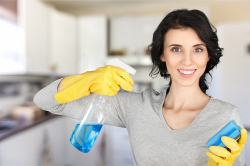 Cleaner checking floor safety and managing wet areas