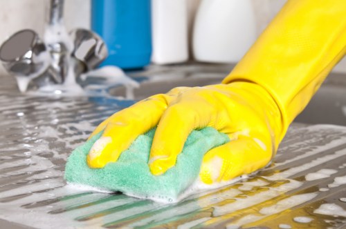 Deep oven cleaning service in E8 with racks and trays being cleaned