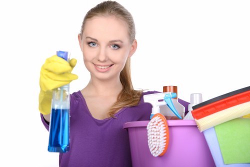 Commercial cleaning team maintaining desks and floors